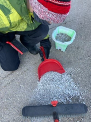 someone sweeping up excess salt